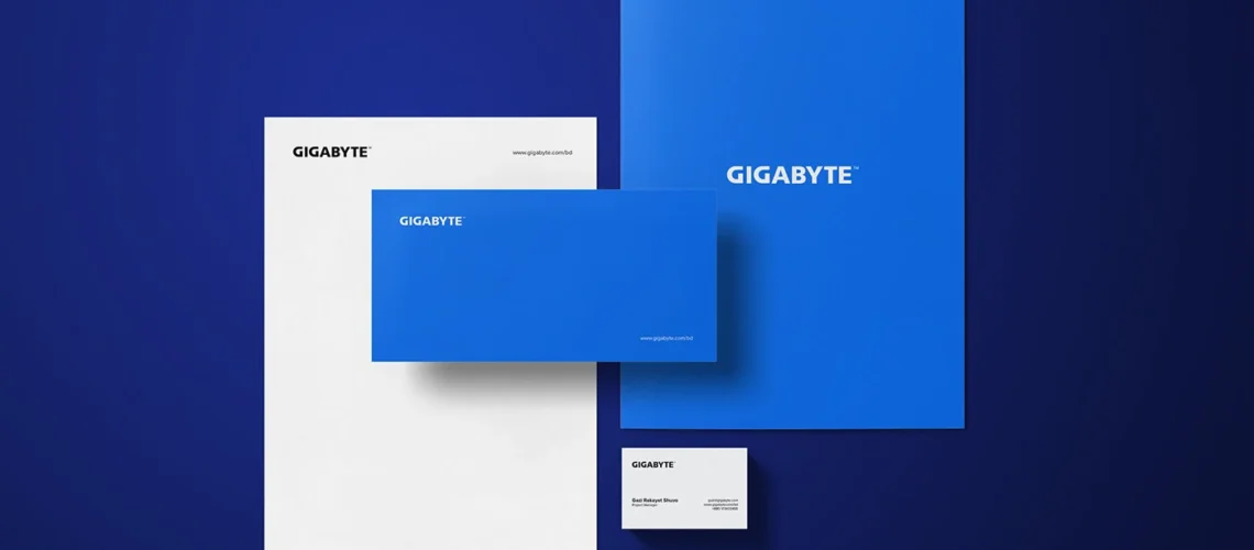 A complete set of GIGABYTE corporate stationery on a dark blue background, including a letterhead, a blue folder, a large blue card, and a small business card.